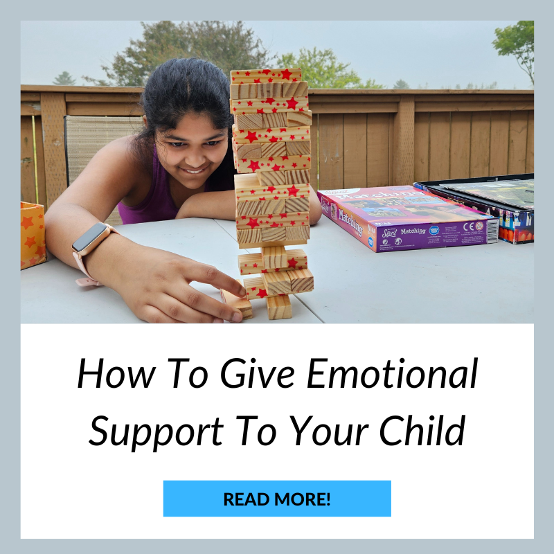 A little girl playing Jenga outside. How to give emotional support to your child thumbnail. 